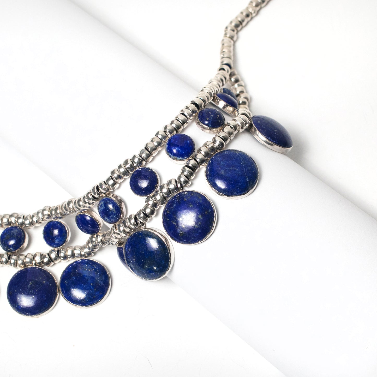 Luxury and Rere finds exclusive statement Necklace design features a Natural Lapis Lazuli in a Circle, Handmade in Sterling Sliver